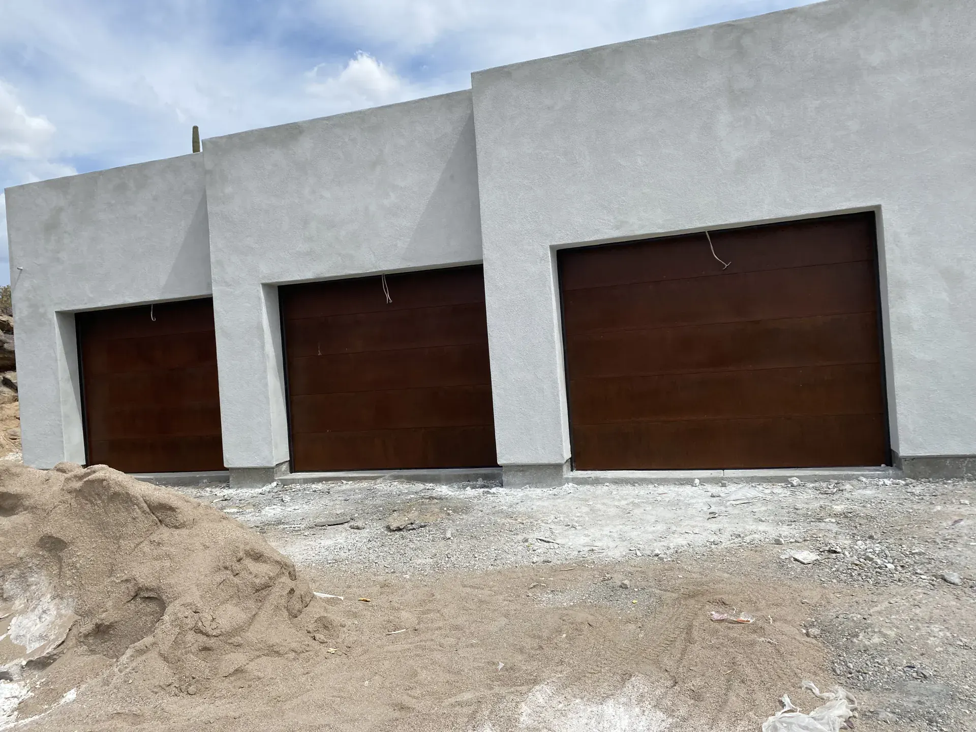 Three new flush brown doors on a new build, a Discount Door Service job in the Tucson area