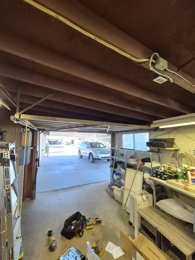 Workshop garage with a wood ceiling and the door open